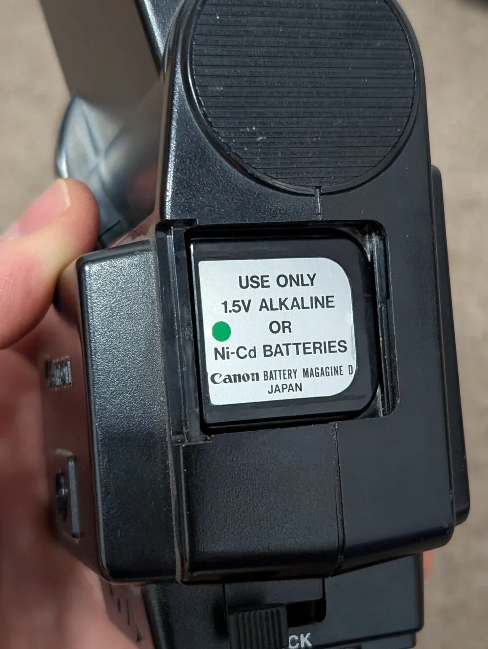 Vintage Canon A-1 Black SLR Camera with Black Lens and Black Flash